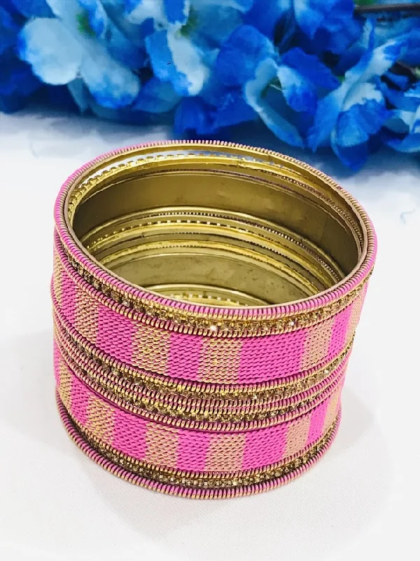 Diamond-Studded Wedding Bangles-Appealing Twisted Spiral Designed Pink Color Metal Bangle Set For Women